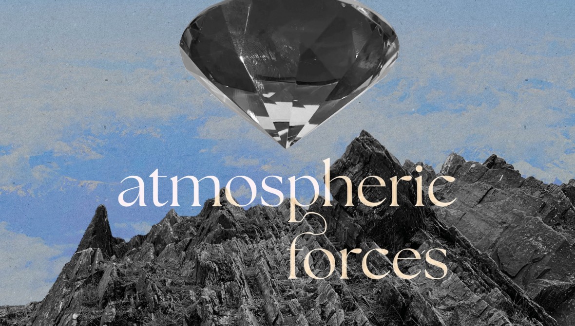 Grey mountain rockface with blue cloud sky above and a clear gemstone shaped object floating above the rocks